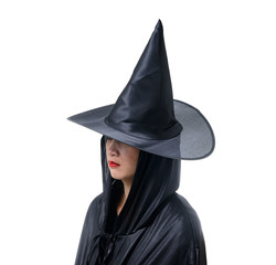 Portrait of woman in black Scary witch halloween costume standing with hat isolated on white background