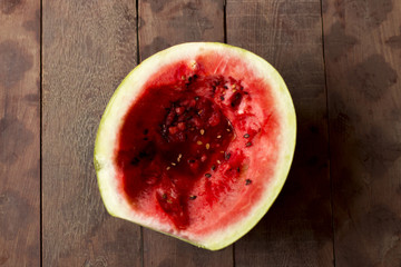 Fototapeta na wymiar watermelon on the table, dark background on top