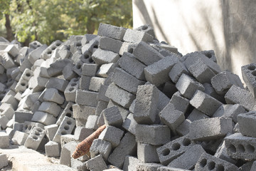 a heap of slag-block bricks for the construction of houses and fences