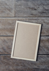 Fototapeta premium The chalkboard on the stand on wooden floor