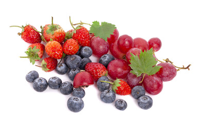 Mix of ripe sweet fruits and berries isolated on white