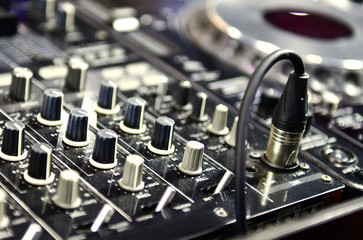 Obraz na płótnie Canvas Close up professional audio DJ's turn table mixer console sound equipment.