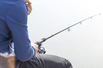 a man is fishing near a river