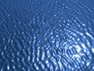 background of blue water in the sun