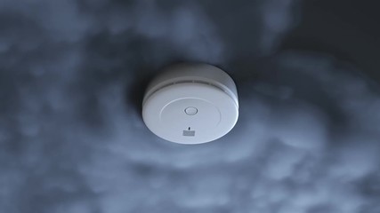 Dense smoke gathering around a smoke detector. Activated alarm. Light blinking.