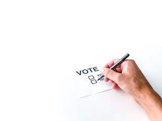 A background image of a male white Caucasian man's hand checking a box on a generic vote ballot with a white background.