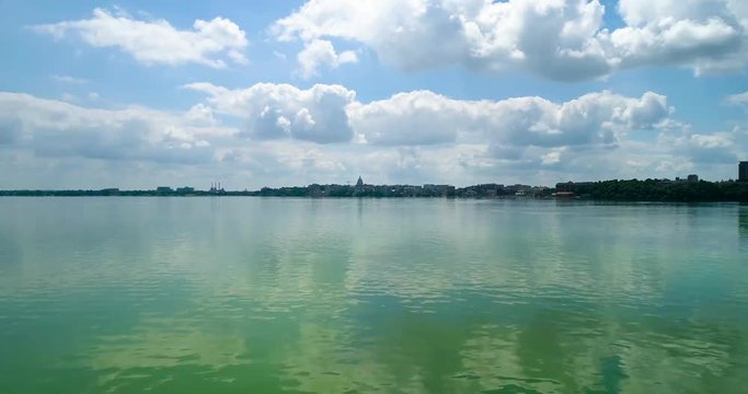 Drone over algal bloom lake and view of the city in Madison, Wisconsin