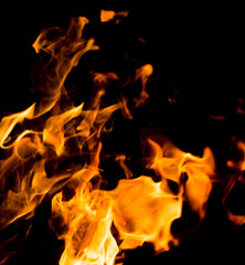 Flame of fire with sparks on a black background