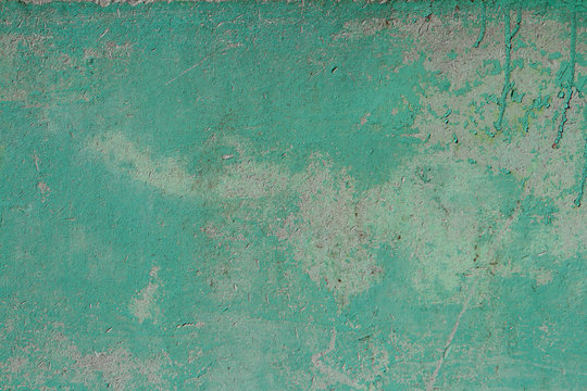 Old texture turquoise blue cracked wall, the old paint texture is chipping and cracked fall destruction. Grunge wall texture.