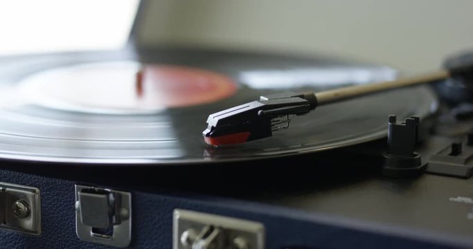 Record player playing vinyl very quickly - close up
