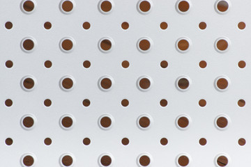 Closeup of metal plate with holes as background
