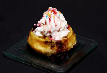 Sweet small cake with cream close up shot