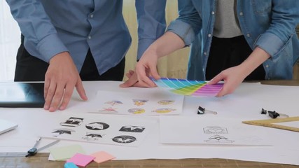 Creative designers picking a color for logo design - Powered by Adobe