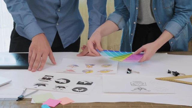Creative designers picking a color for logo design