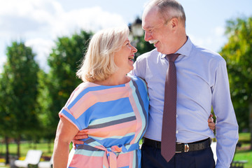 Naklejka premium Senior couple walking in summer in park