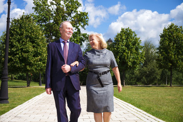Fototapeta premium Senior couple walking in summer in park