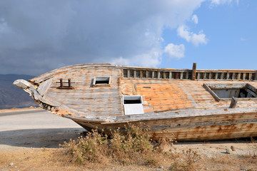 Fototapeta na wymiar Broken abandoned boat