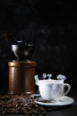 Obraz na płótnie Canvas Coffee grinder mill with coffee cup 