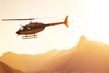 Foto op Plexiglas helikopter boven de Rio © Sergii Mostovyi