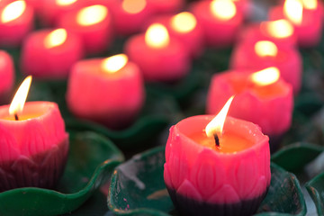 Flower candles burning at night.