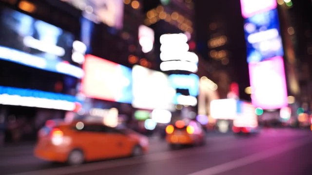 Times Square At Night out of focus traffic, billboard and lights, New York City