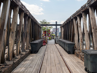 Wooden dock walk way leading to a retail and restaurant area 