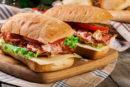 Ciabatta sandwich with smoked bacon and other - Powered by Adobe