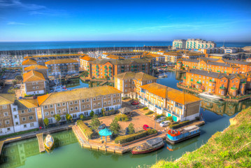 Brighton marina boats, yachts and apartments East Sussex England UK in bright colourful HDR