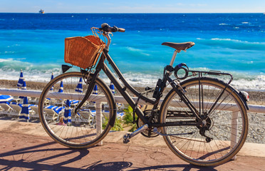 Bicycle on Promenade des Anglais with the Mediterranean sea in the background in Nice France