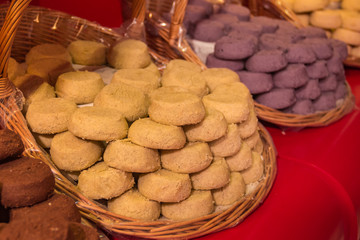 French almond cookies in a basket on display at a bakery in Nice France