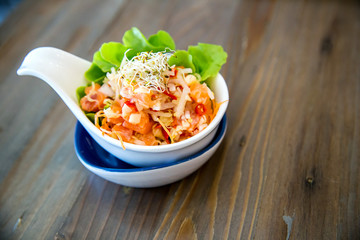 salmon spicy salad. Japanese and thai fusion food. image for background, wallpaper  menu list and copy space.
