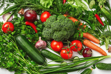 A set of vegetables, tomatoes, zucchini, broccoli, carrots, parsley, onions, cucumber. Fresh natural vegetables.