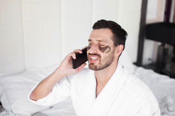 Man making some important calls after waking up