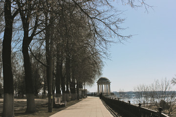 river embankment and gazebo on a bright spring day