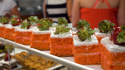 Restaurant Buffet. In the foreground there are plates with dessert.