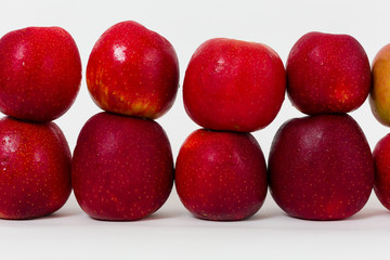 Red apples on the white background 