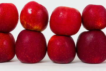 Red apples on the white background 