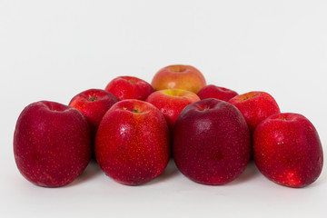 Red apples on the white background 