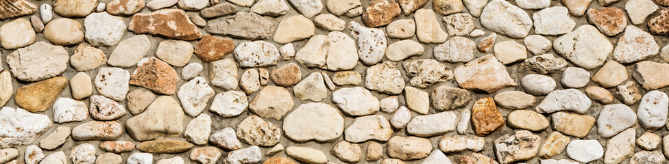 Stone wall texture background, panorama of masonry