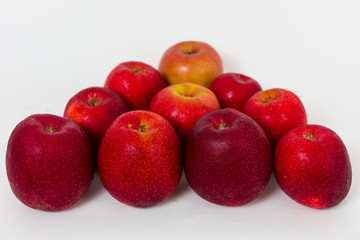 Red apples on the white background 