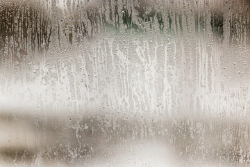 Wetted glass on the window as a background
