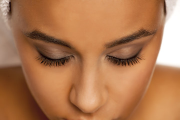 natural eyebrow and eyelashes with mascara of dark skinned female