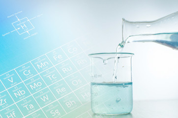 Laboratory glassware with periodic table of elements.