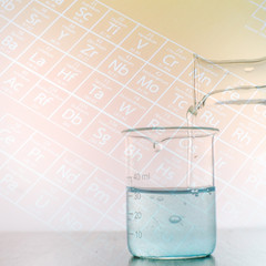 Laboratory glassware with periodic table of elements.