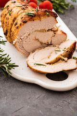 Roasted turkey breast with spicy herbs, selective focus. Copy space.