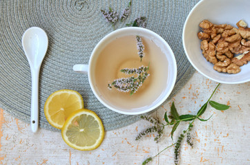  herbal tea with lemon and mint in a white mug