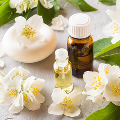 Obraz na płótnie Canvas Jasmine oil. Aromatherapy with Jasmine oil and soap. Jasmine flower