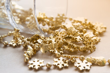 Christmas ornaments, gold snowflakes with sunlight and shiny