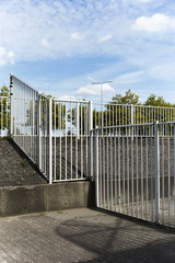White Steel Fence In Car Park