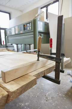 Vise grip clamping wood in carpentry workshop
